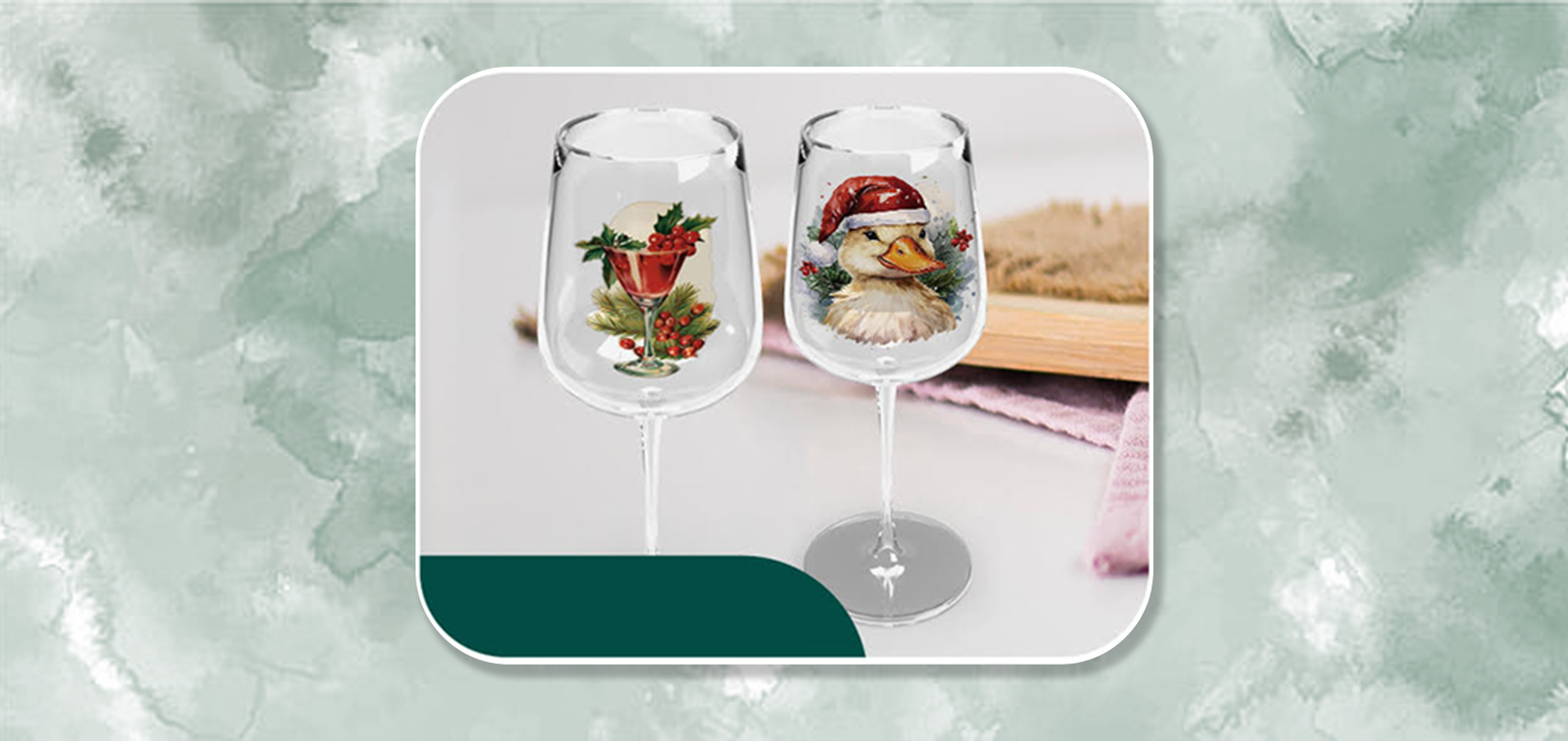 Two festive wine glasses with Christmas designs